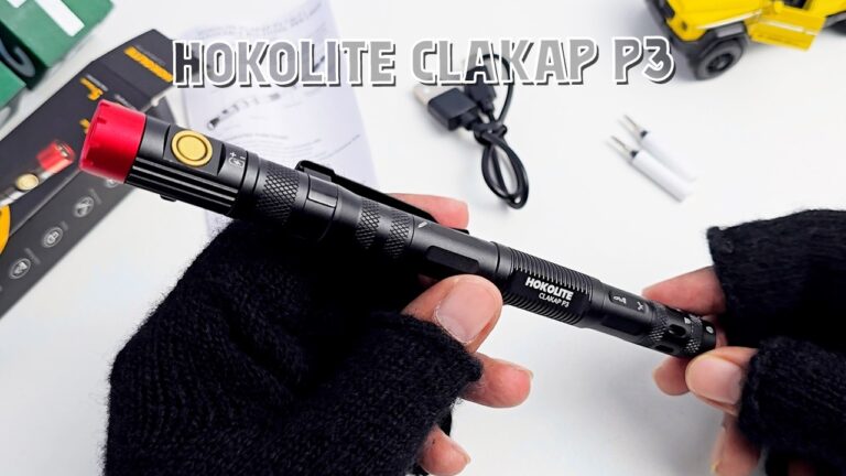 A close-up of the HOKOLITE CLAKAP P3 7-in-1 Pen light showing its machined aluminum body and pen tip.