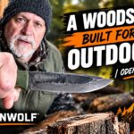 A close-up of the OdenWolf Woods Knife showing its D2 steel blade and Scandi grind geometry.