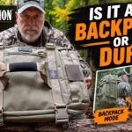 A person demonstrating the clamshell opening and internal organization of the Maxpedition Fliegerduffel.