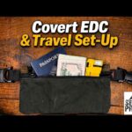 A wax canvas Paladin33 P33 Bail Pouch shown with a small knife, flashlight, and water filter.