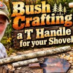 A woodworker using a jackknife to carve a hickory wood handle for a shovel.